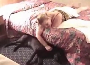 Blonde slut with large breasts is totally dominated by a doggo